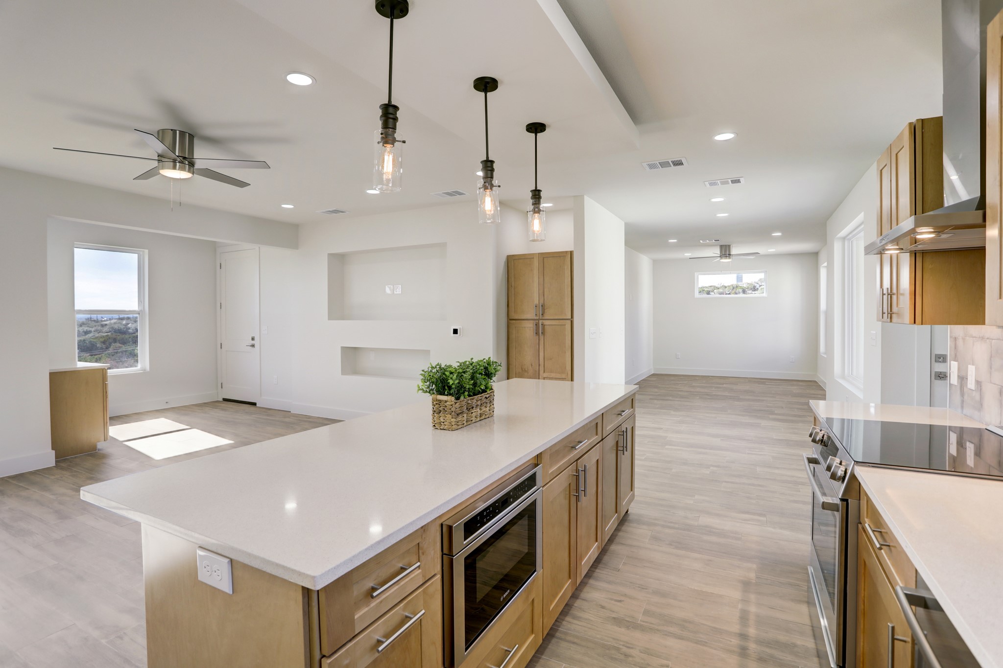 4300 Mansfield Dam Road, Unit 1221 Austin, TX 78734 - Photo 19 of 38 a kitchen with kitchen island a sink counter top space stainless steel appliances and a counter top space