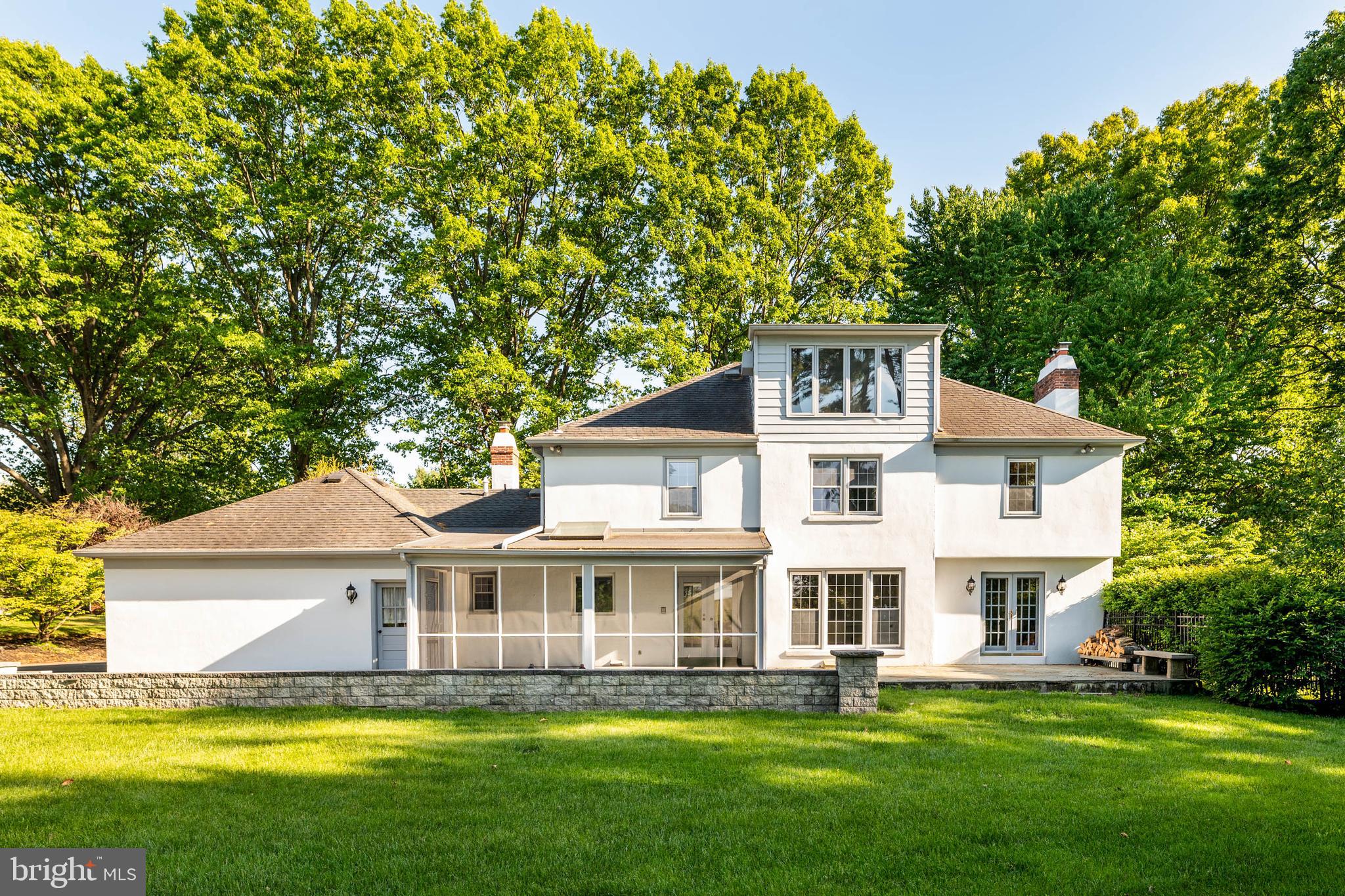 533 Gulph Road Wayne, PA 19087 - Photo 4 of 43 a front view of a house with a garden