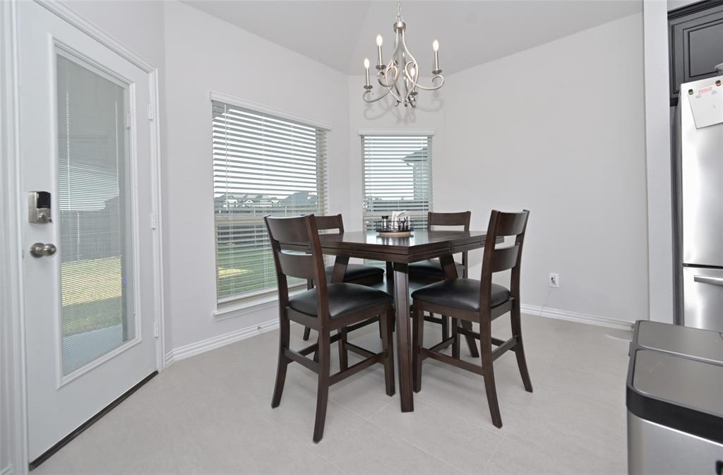 1802 Ranch View Drive Cedar Hill, TX 75104 - Photo 11 of 40 a view of a dining room with furniture and window