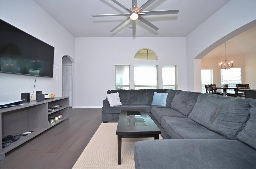 1802 Ranch View Drive Cedar Hill, TX 75104 - Photo 15 of 40 a living room with furniture and a flat screen tv