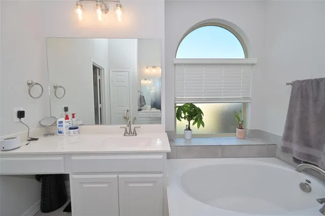 a bedroom with a bed and a cabinets