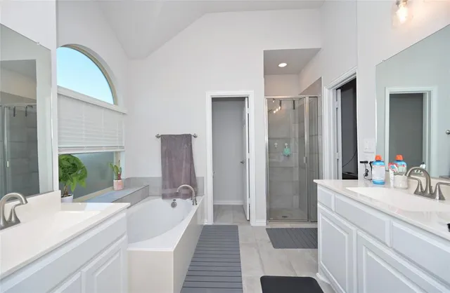 a bedroom with a bed and a ceiling fan