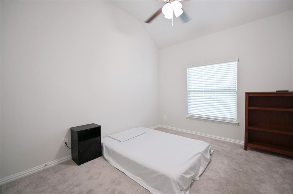 1802 Ranch View Drive Cedar Hill, TX 75104 - Photo 30 of 40 a bedroom with a bed and a cabinets