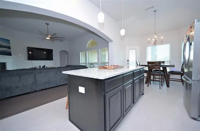 a view of a dining room with furniture and window