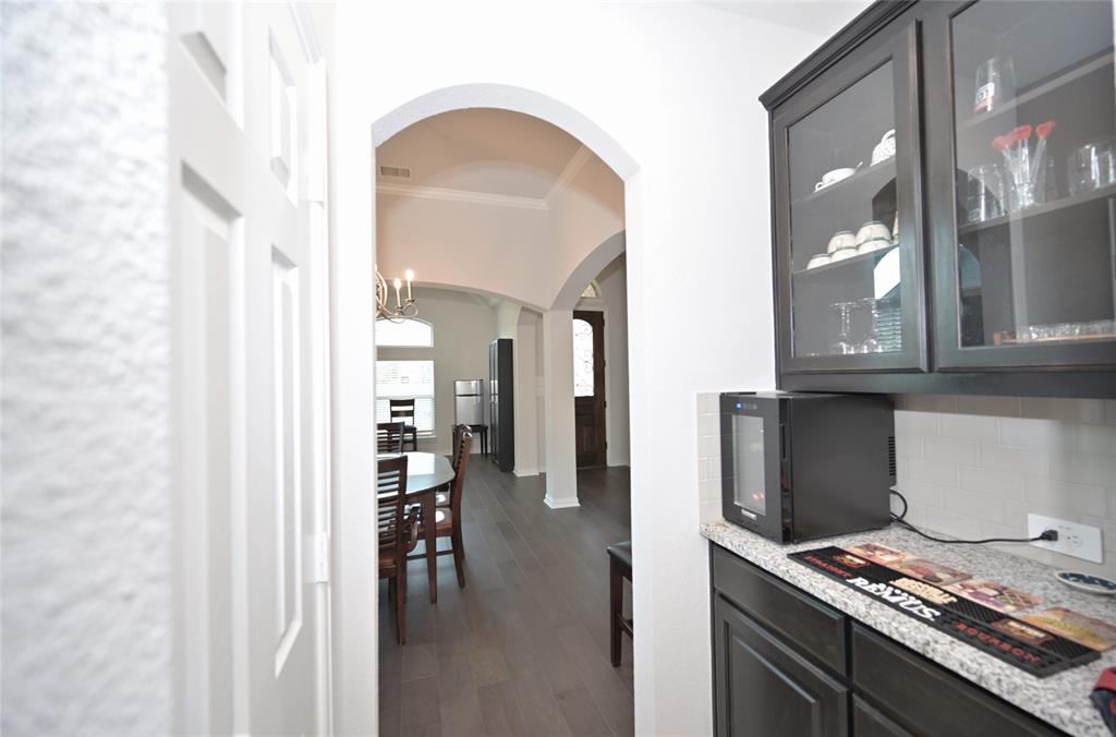 1802 Ranch View Drive Cedar Hill, TX 75104 - Photo 10 of 40 a kitchen with stainless steel appliances granite countertop a stove and a refrigerator