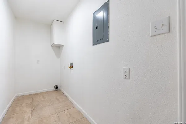 a view of a refrigerator in bathroom