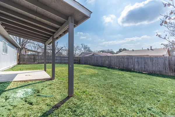 a view of yard with trampoline