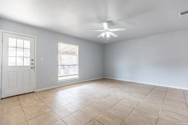 a view of an empty room with a window