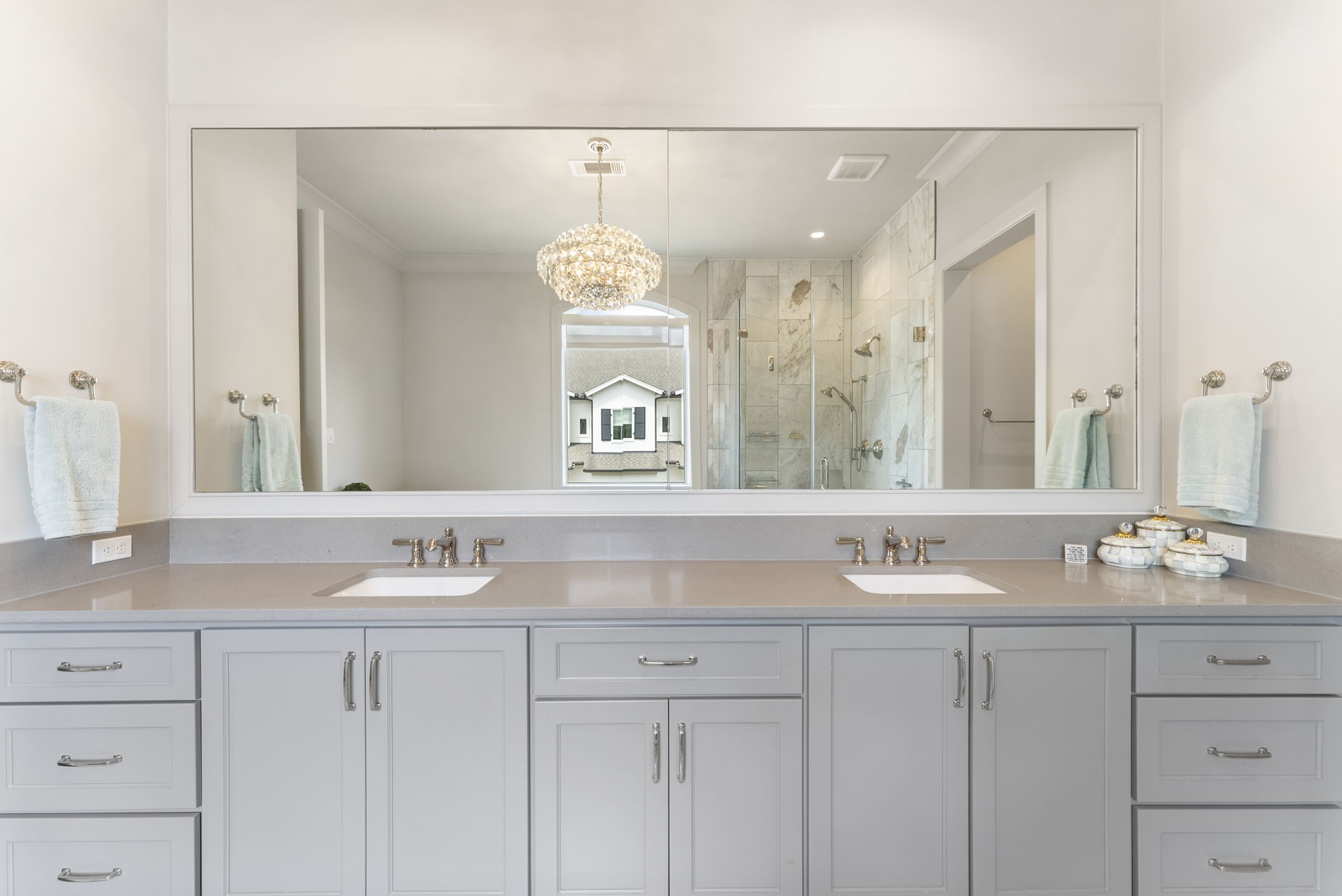 10 Nautical Terrace Way The Woodlands, TX 77380 - Photo 19 of 28 Separate sinks, quartz counters and extensive drawer storage provide space for two, with a custom walk-in closet just beyond.