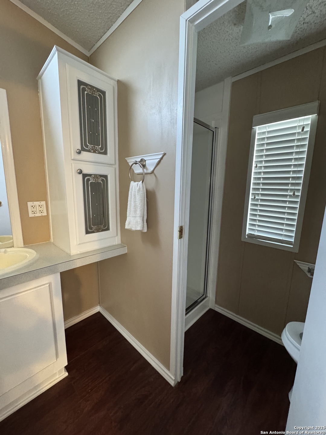 110 Deer Park Road, Unit B La Vernia, TX 78121 - Photo 10 of 12 a view of a kitchen with wooden floor and staircase