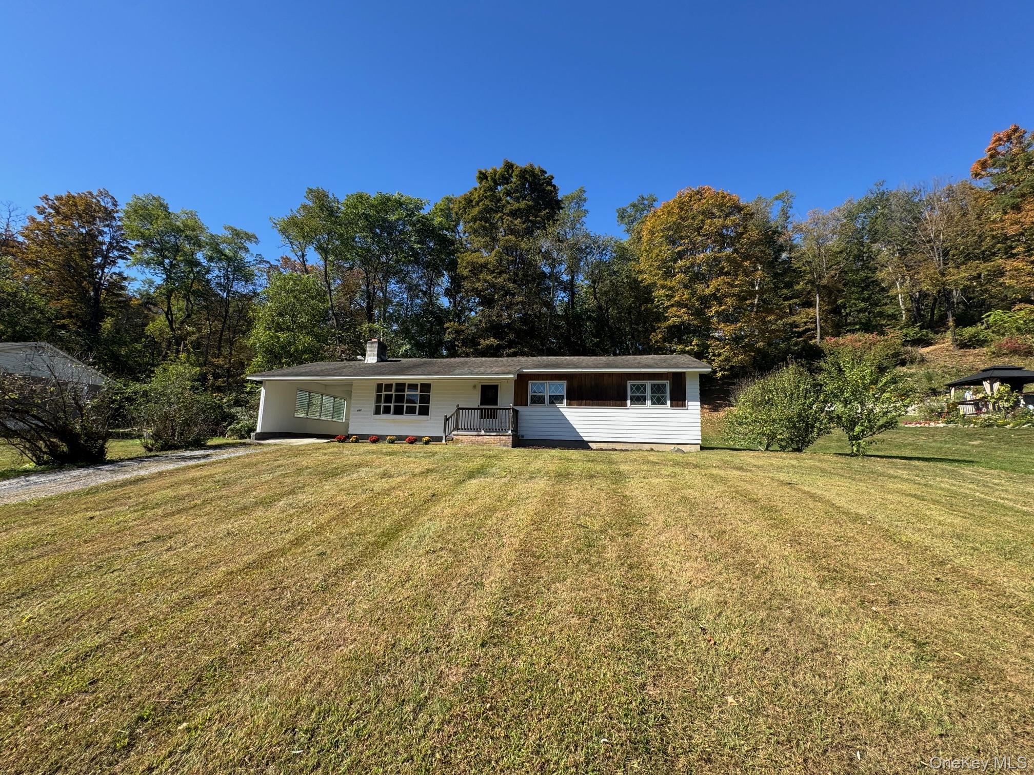 661 Traver Road Pleasant Valley, NY 12569 - Photo 1 of 1 a front view of a house with a garden
