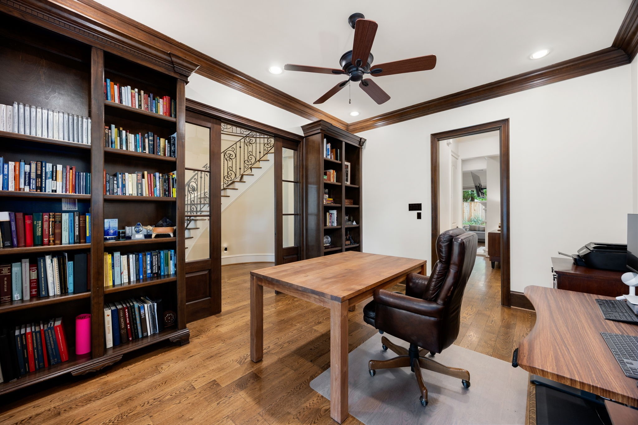 13310 Apple Tree Road Houston, TX 77079 - Photo 17 of 50 Built in bookshelves and sliding, glass pocket doors complete the home office study.