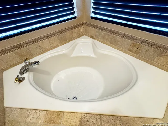 a bathroom with a sink and shower