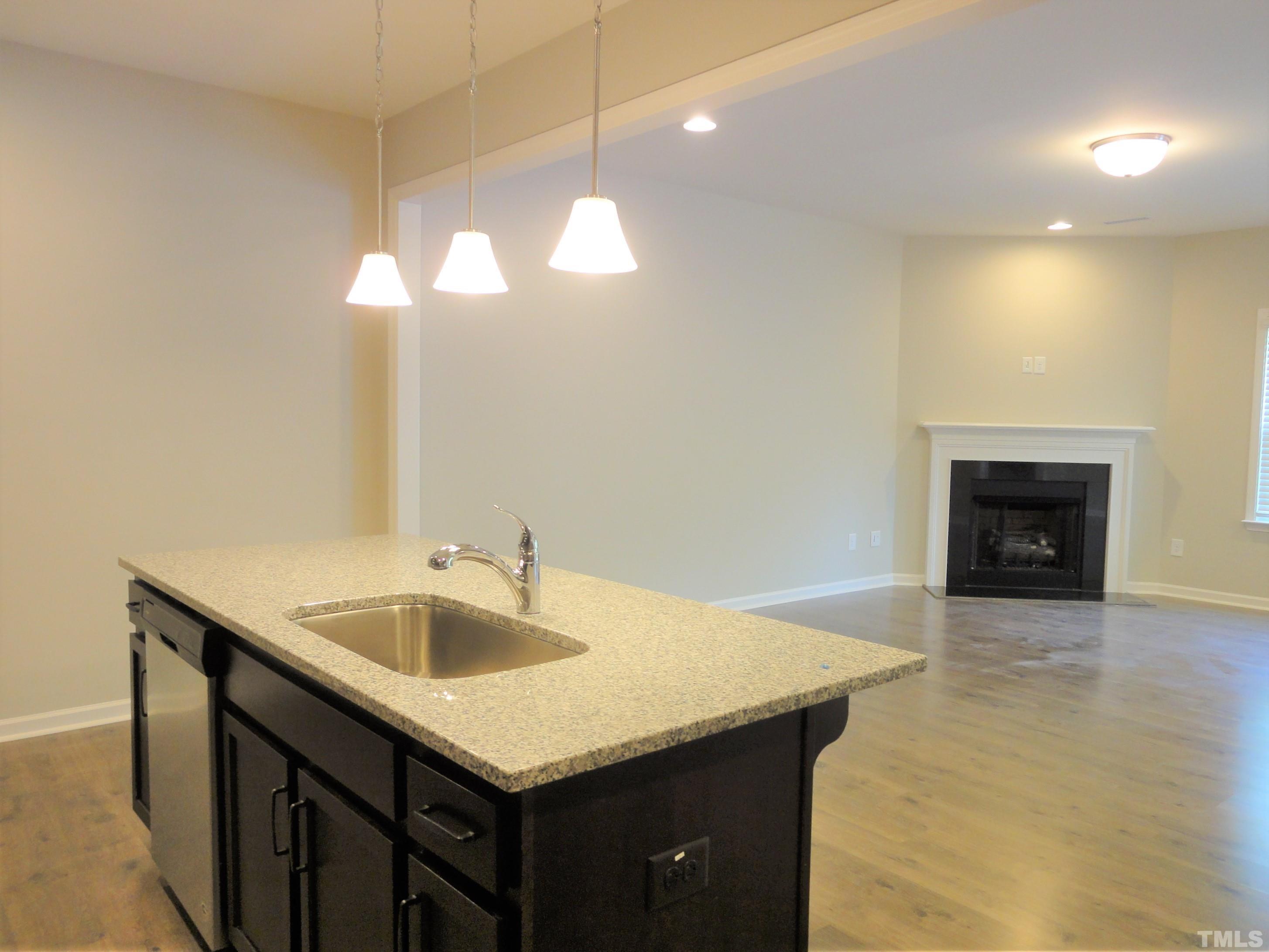 565 Metro Station Apex, NC 27502 - Photo 11 of 29 a bathroom with a sink and a mirror