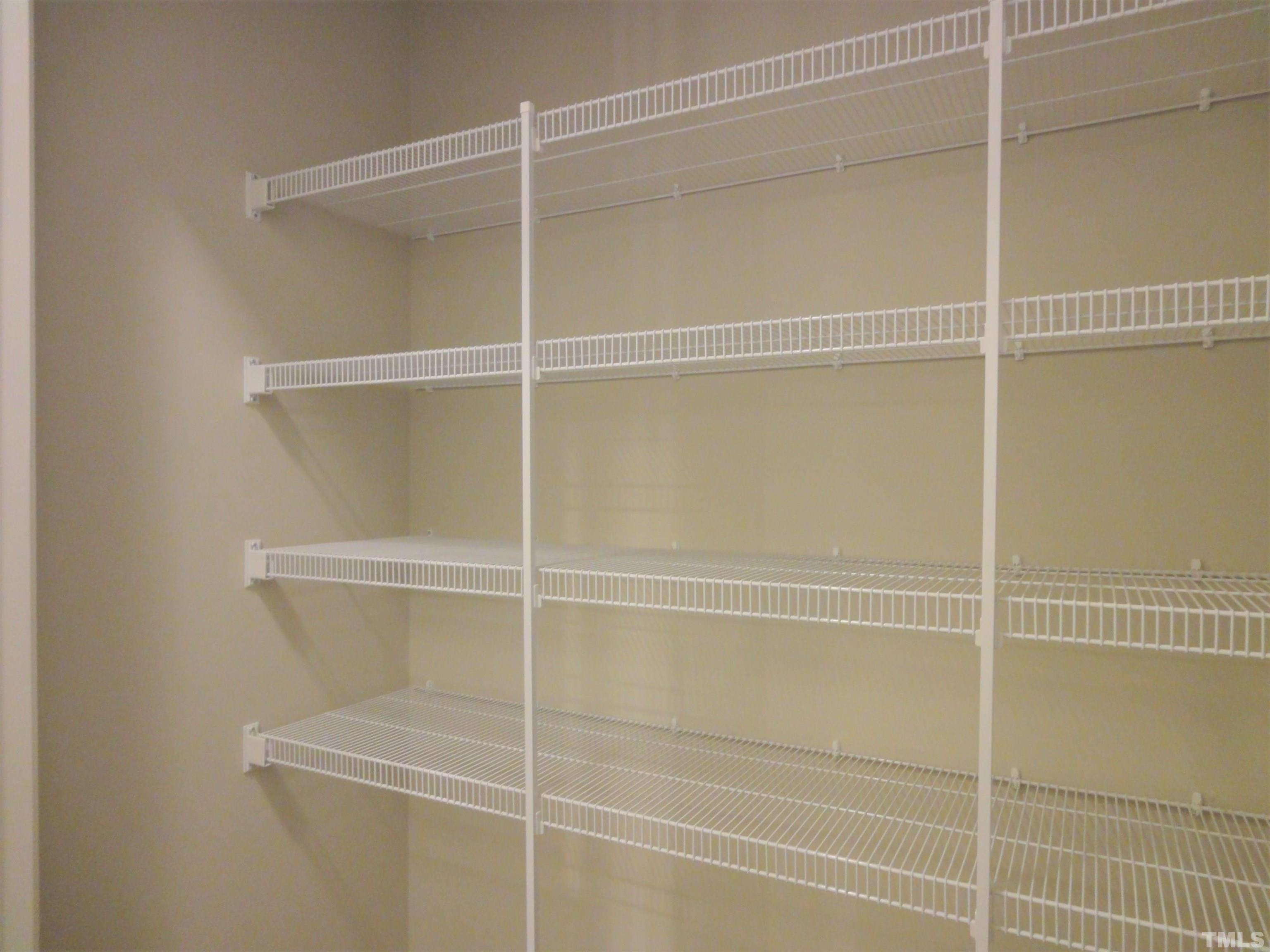 565 Metro Station Apex, NC 27502 - Photo 14 of 29 a view of a walk in closet