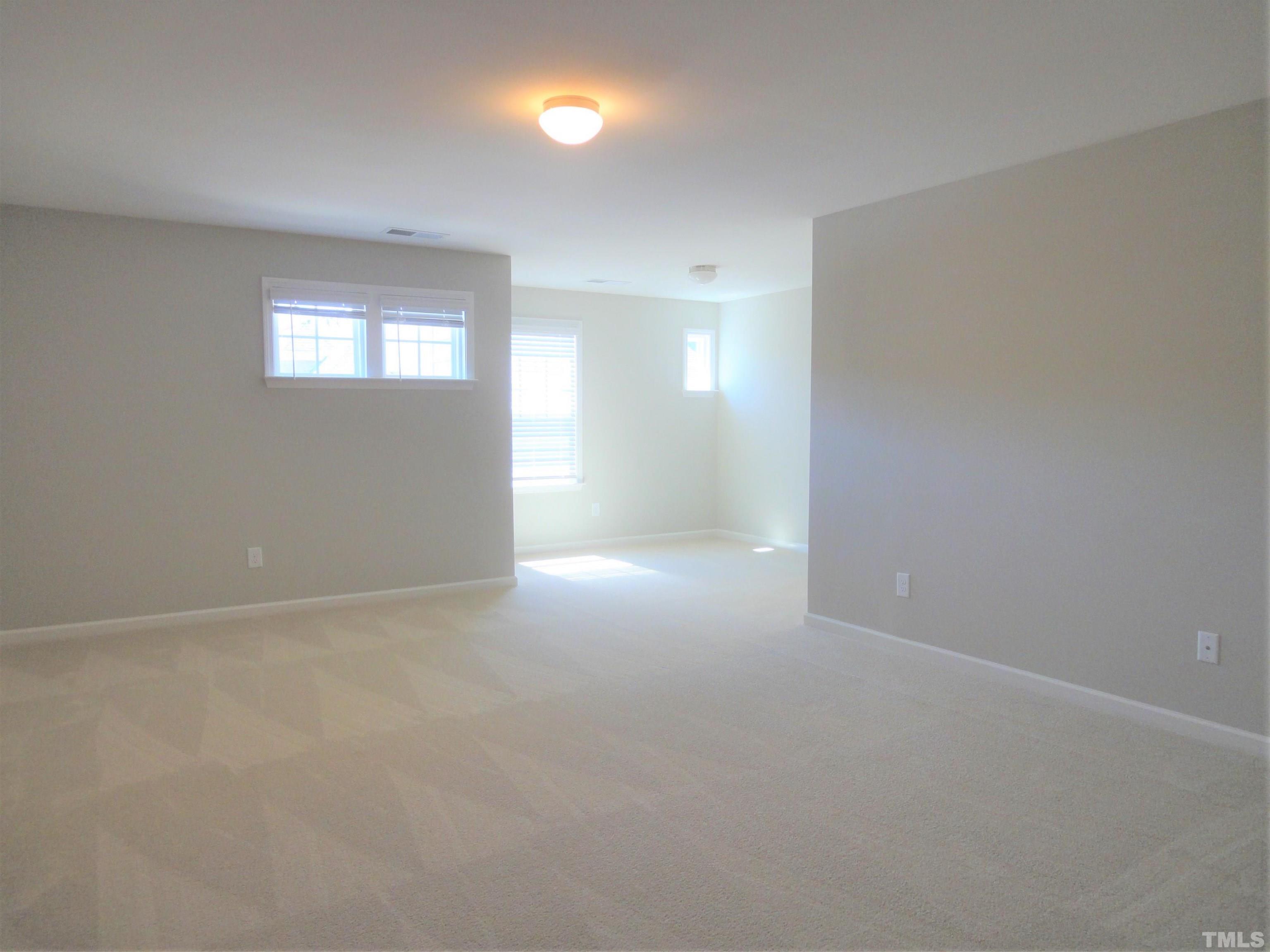 565 Metro Station Apex, NC 27502 - Photo 17 of 29 a view of an empty room with a window