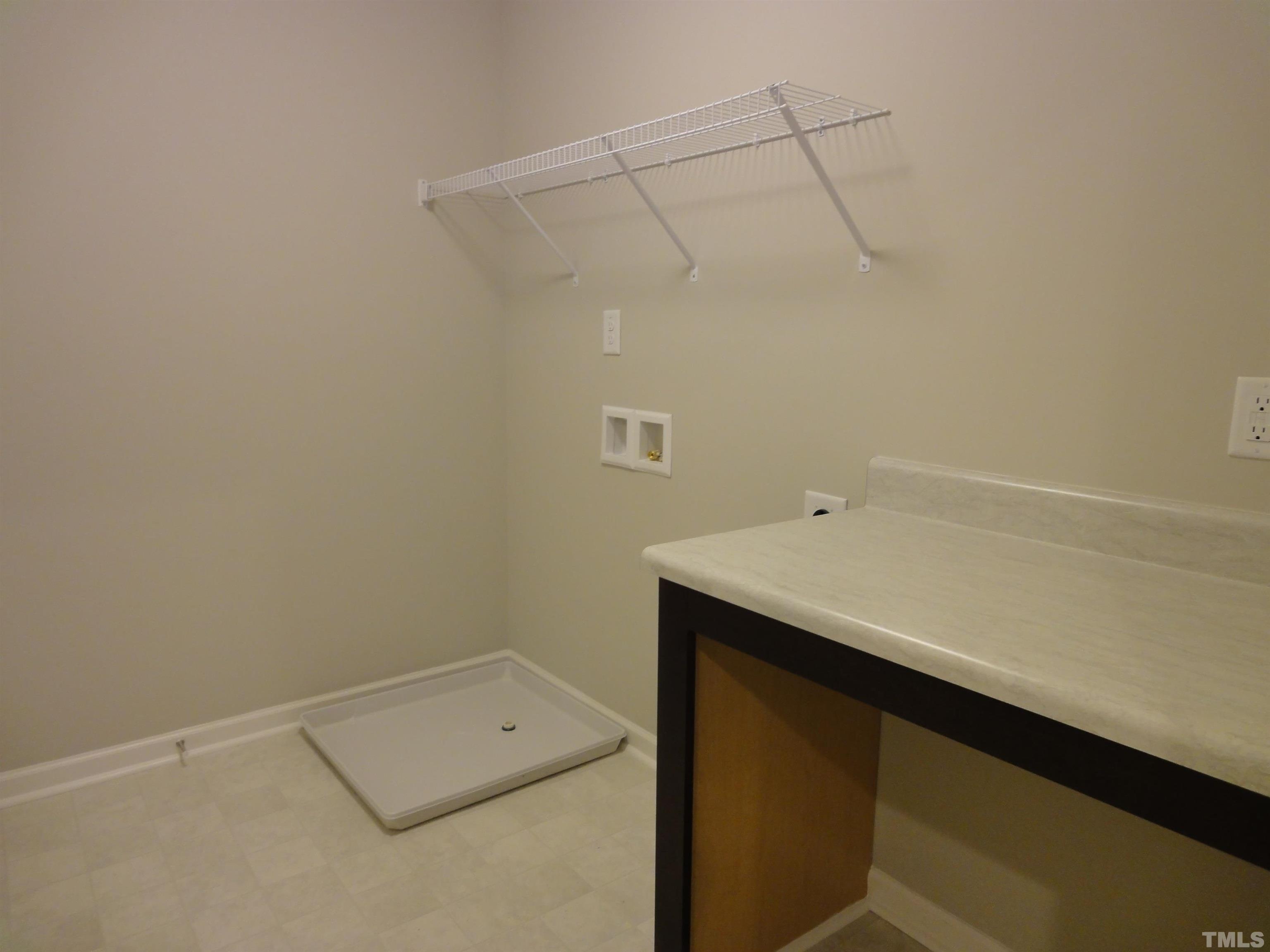 565 Metro Station Apex, NC 27502 - Photo 20 of 29 a utility room with dryer and washer