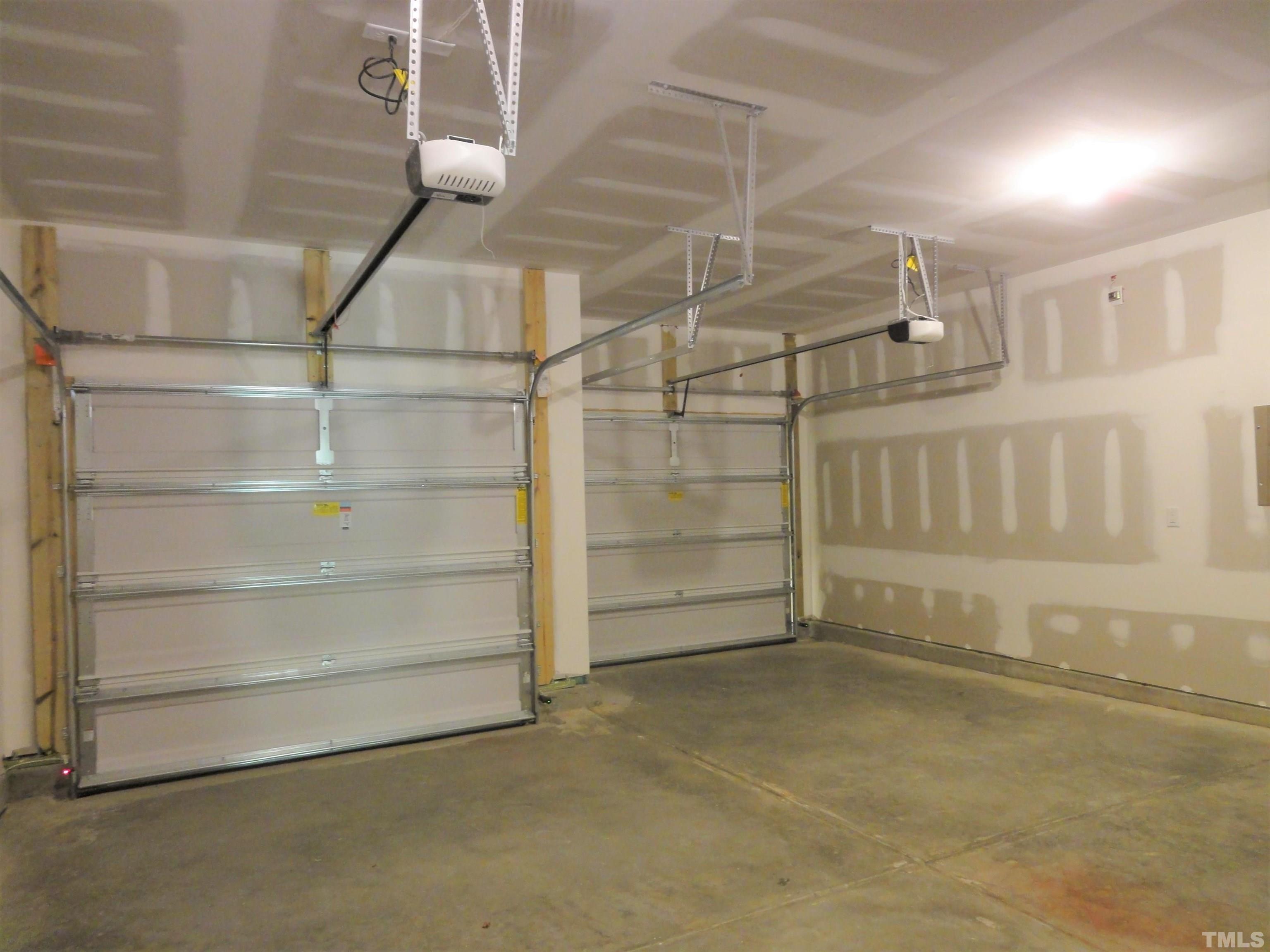 565 Metro Station Apex, NC 27502 - Photo 25 of 29 a view of an empty room with racks on the wall