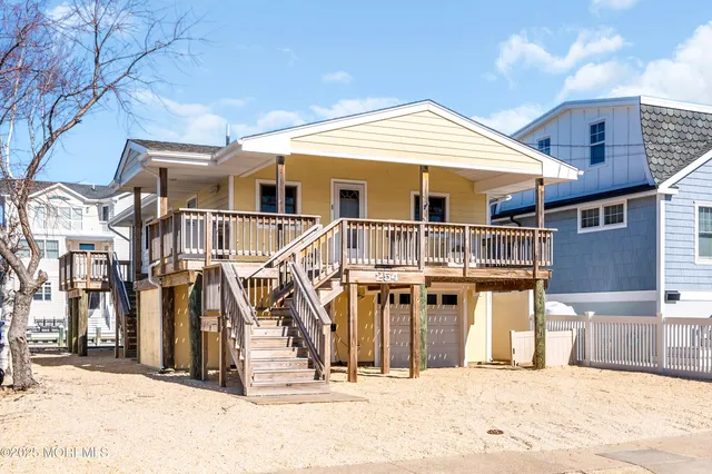 a view of a house with wooden stairs