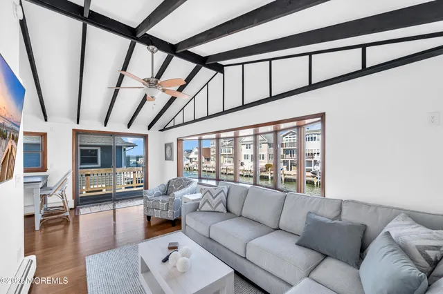a very nice looking room with a dining table chairs and entryway