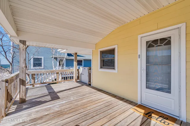 a view of a house with wooden deck