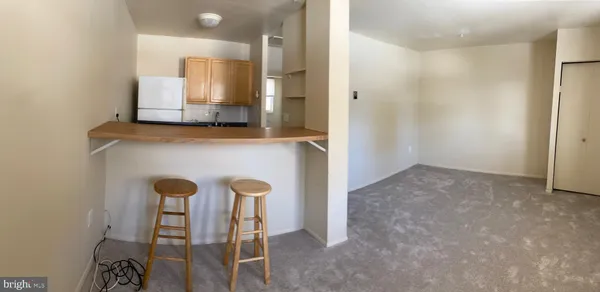 a view of dining room with furniture and wooden floor