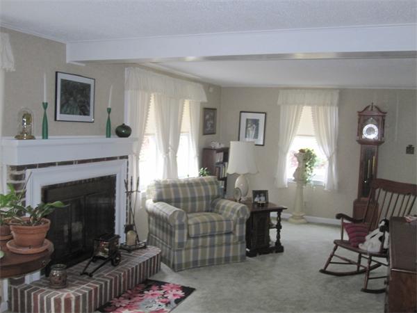 2115 Calkins Road Palmer, MA 01069 - Photo 14 of 22 a living room with furniture and a fireplace