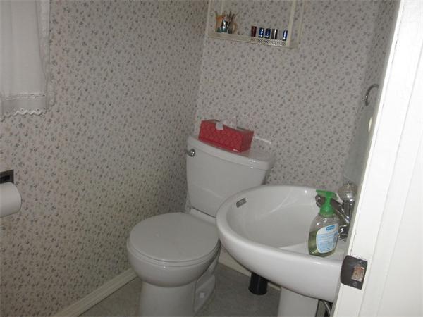 2115 Calkins Road Palmer, MA 01069 - Photo 16 of 22 a white toilet sitting next to a white chair