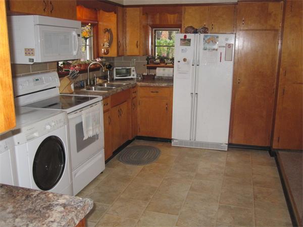 2115 Calkins Road Palmer, MA 01069 - Photo 2 of 22 a kitchen with refrigerator and cabinets