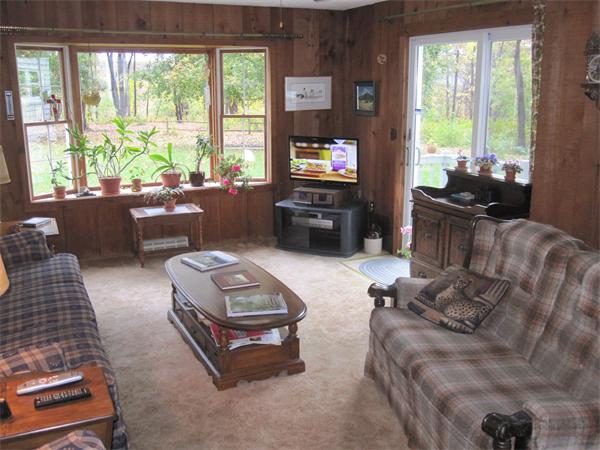 2115 Calkins Road Palmer, MA 01069 - Photo 3 of 22 a living room with furniture and a flat screen tv