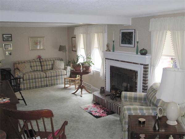 2115 Calkins Road Palmer, MA 01069 - Photo 4 of 22 a living room with furniture and a fireplace