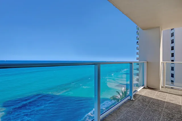 an aerial view of a house with a swimming pool
