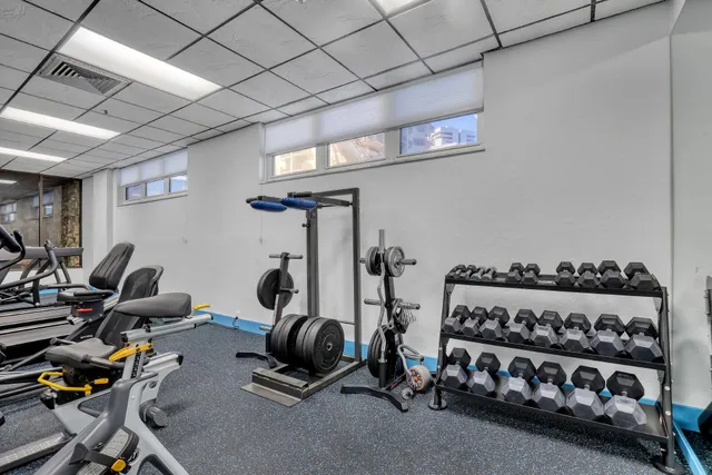 a room with pool table and windows