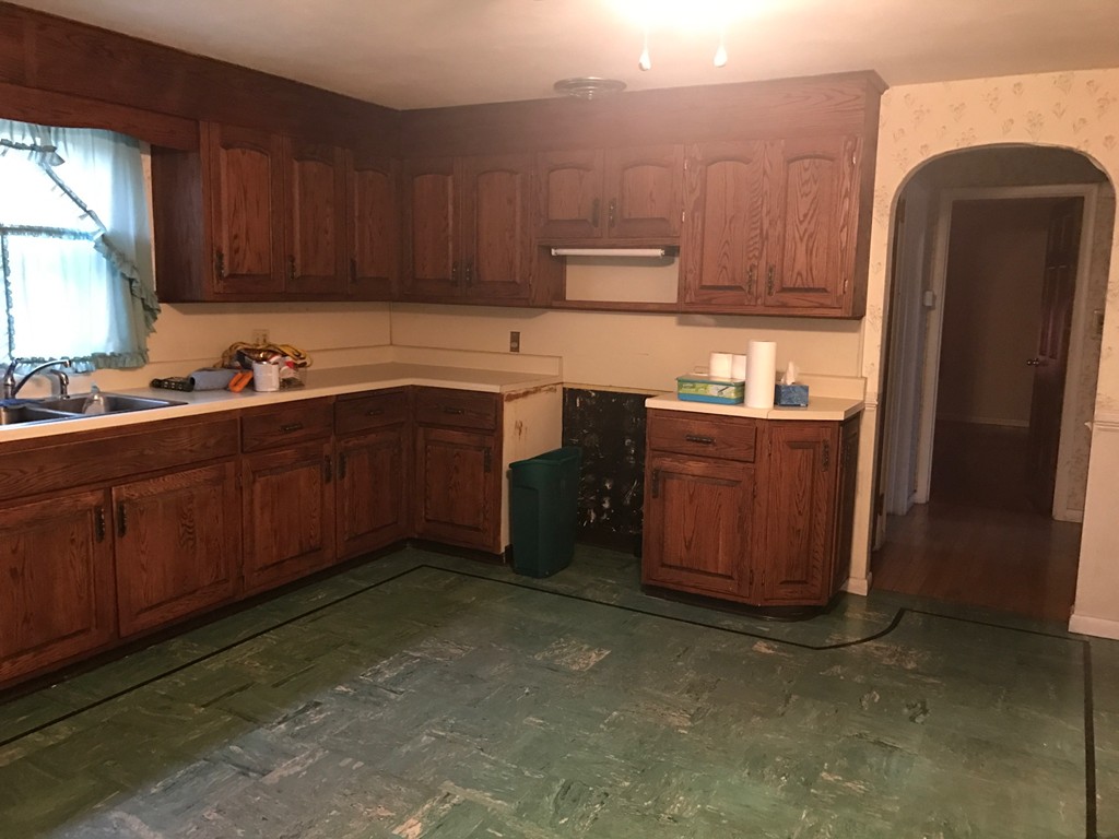 79 Haller Street Springfield, MA 01151 - Photo 15 of 26 a kitchen with stainless steel appliances granite countertop a refrigerator a sink dishwasher and wooden cabinets with a dishwasher