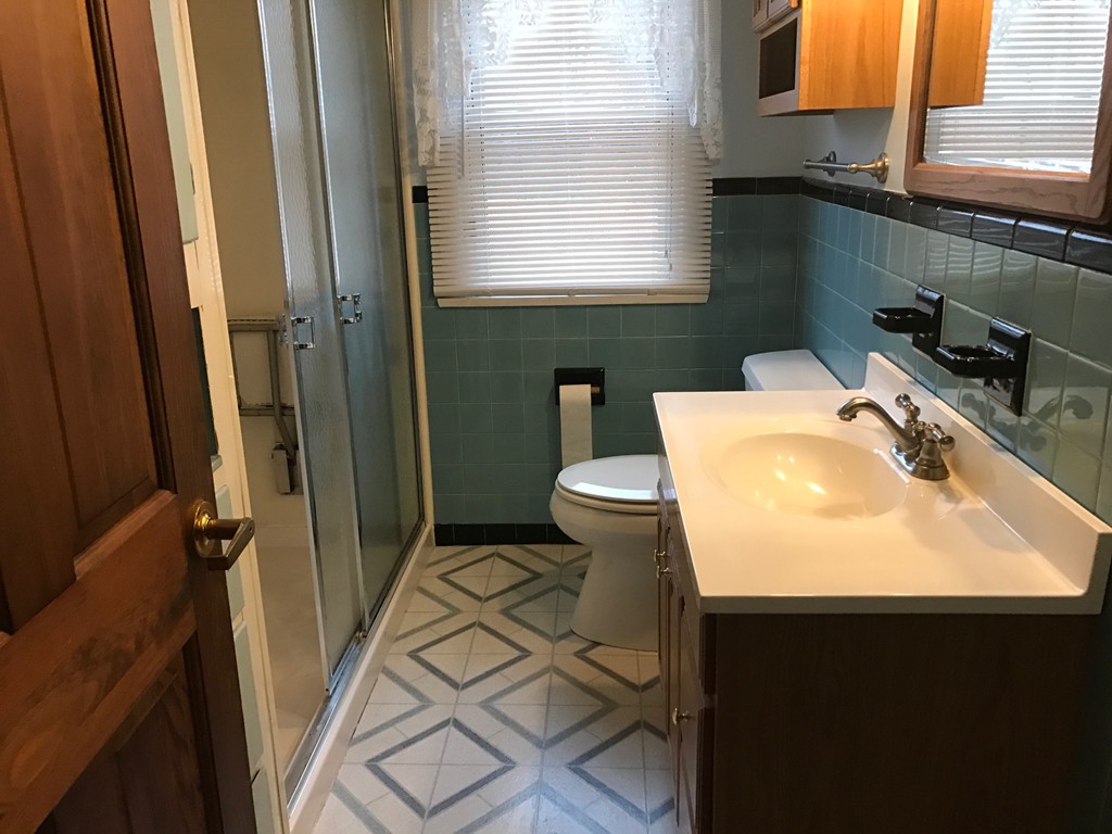 79 Haller Street Springfield, MA 01151 - Photo 18 of 26 a bathroom with a sink toilet and shower