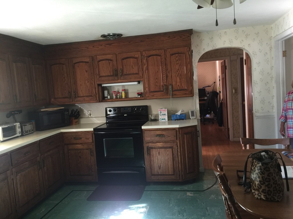 79 Haller Street Springfield, MA 01151 - Photo 2 of 26 a kitchen with stainless steel appliances granite countertop a sink stove and cabinets