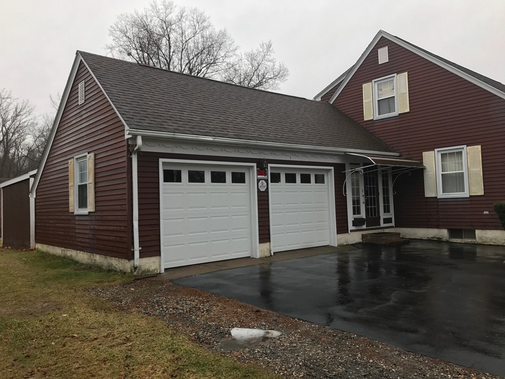 79 Haller Street Springfield, MA 01151 - Photo 24 of 26 a front view of a house with a yard