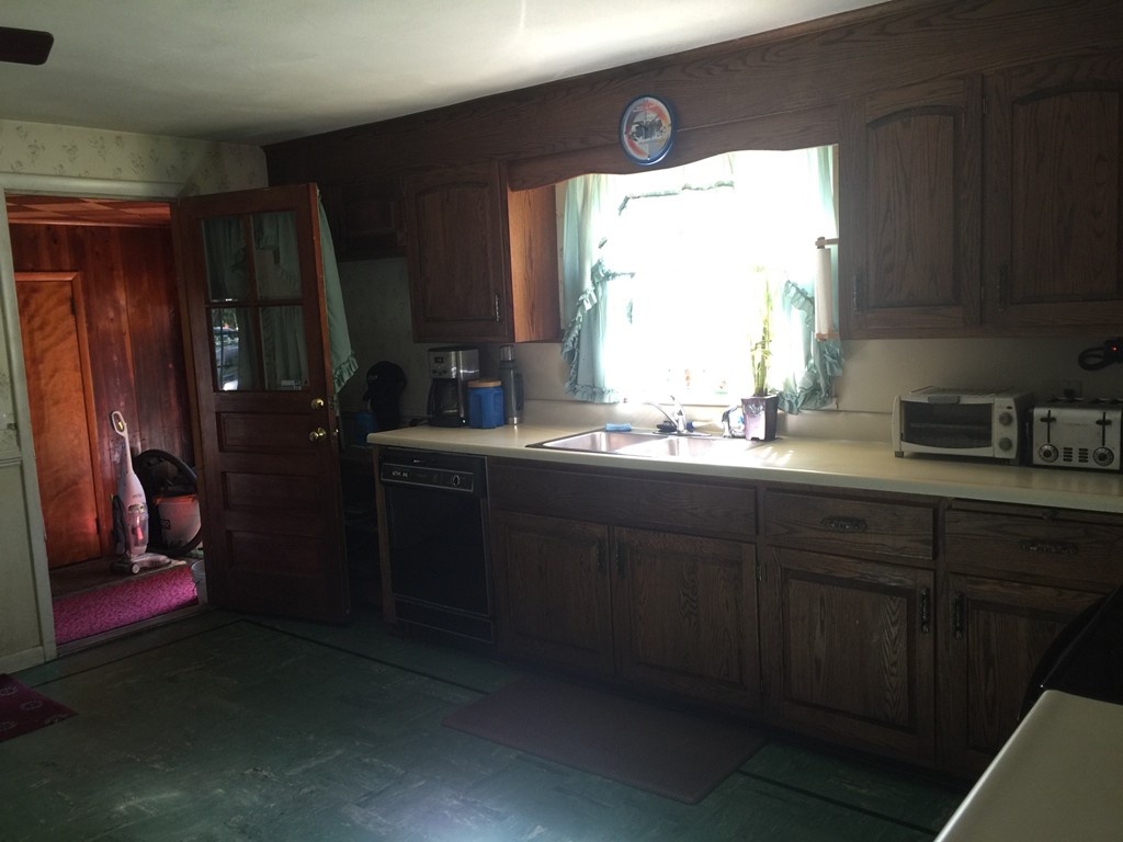 79 Haller Street Springfield, MA 01151 - Photo 3 of 26 a kitchen with a sink and a window