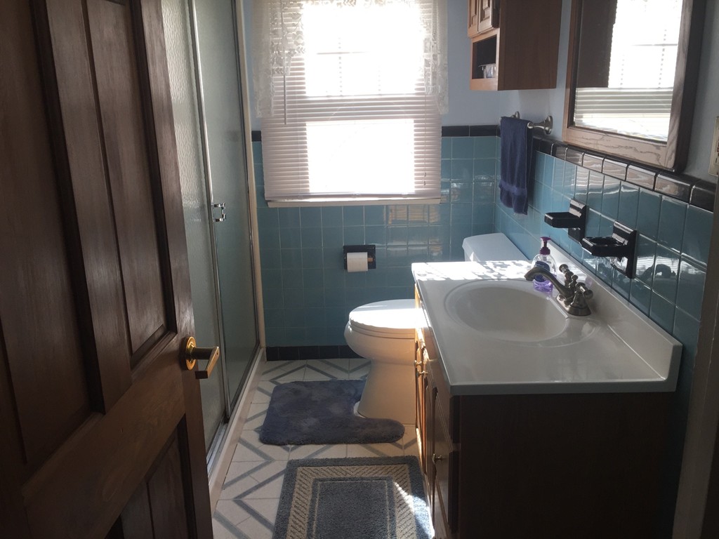 79 Haller Street Springfield, MA 01151 - Photo 5 of 26 a bathroom with a sink toilet and window