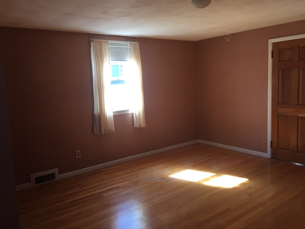 79 Haller Street Springfield, MA 01151 - Photo 7 of 26 a view of empty room with wooden floor and fan