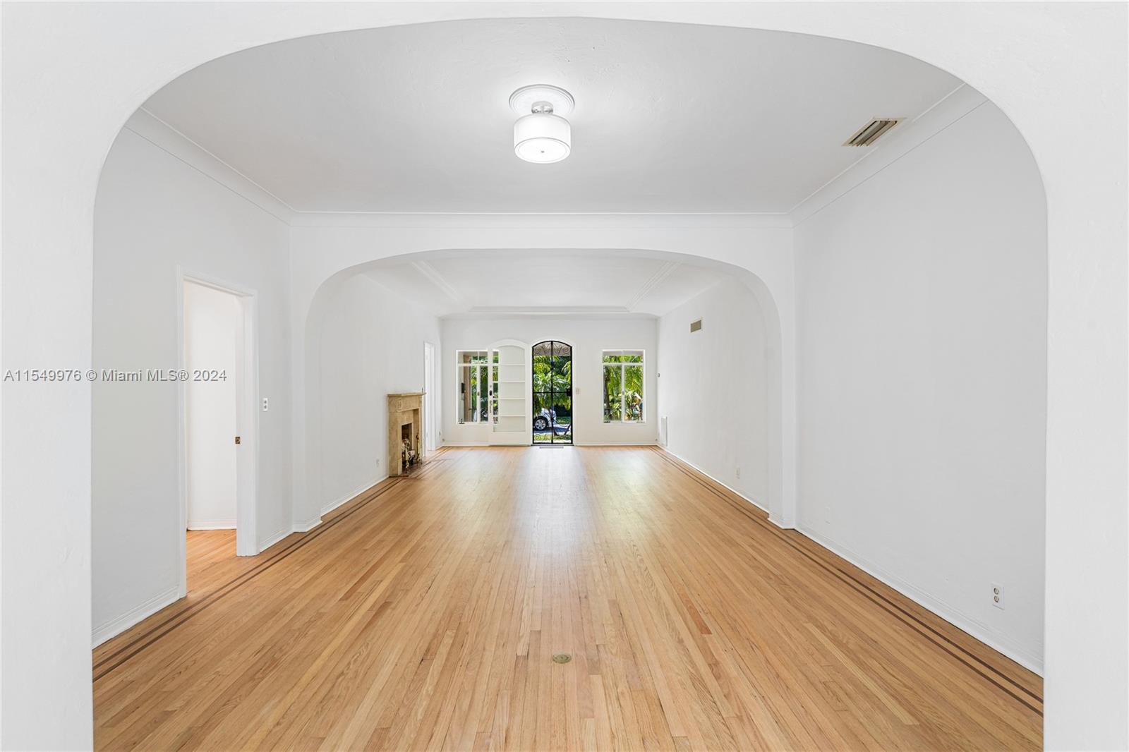 2935 North Bay Road Miami Beach, FL 33140 - Photo 12 of 36 a view of empty room with wooden floor