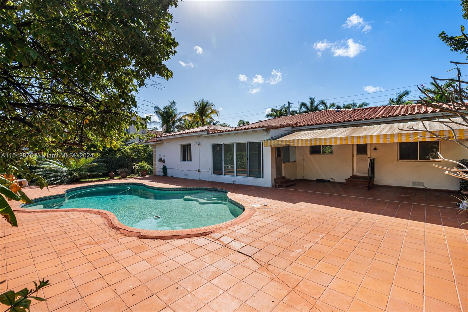 2935 North Bay Road Miami Beach, FL 33140 - Photo 27 of 36 a view of a house with backyard and sitting area