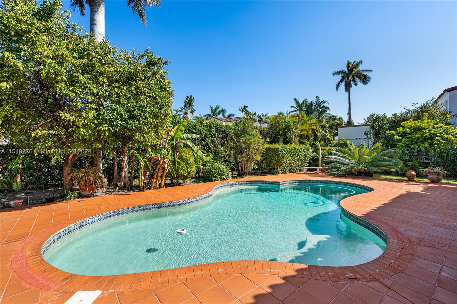 2935 North Bay Road Miami Beach, FL 33140 - Photo 28 of 36 a view of a swimming pool with an outdoor space