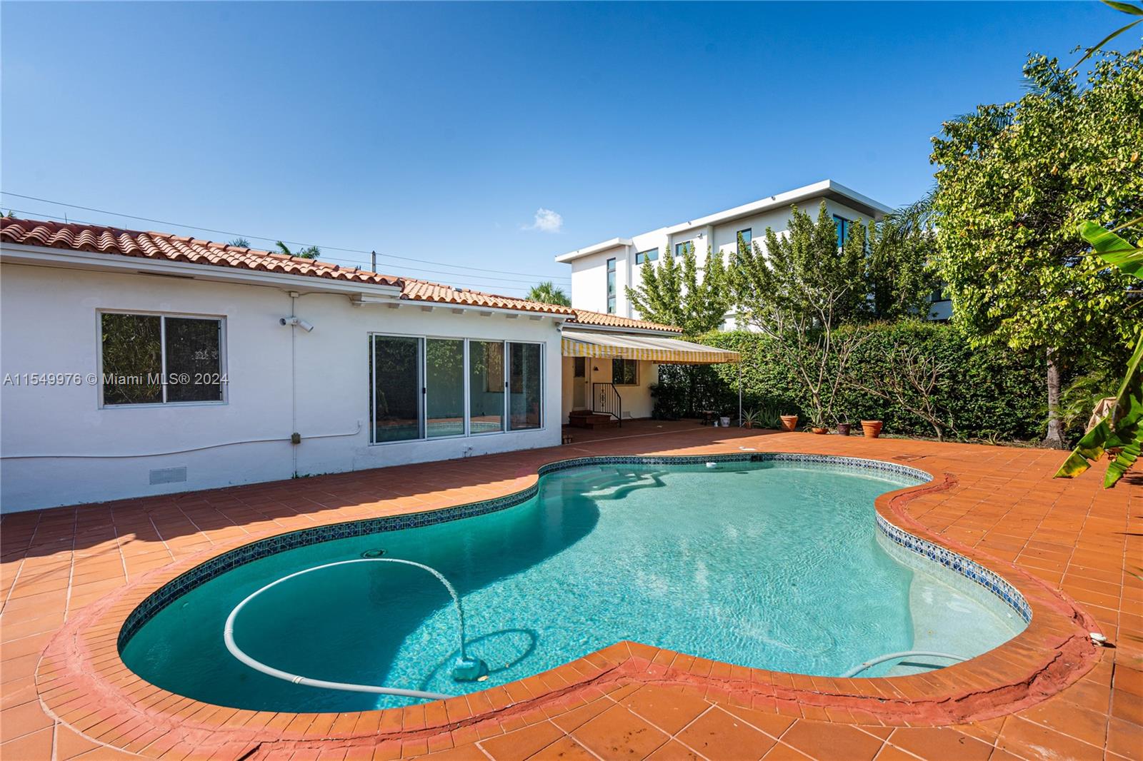 2935 North Bay Road Miami Beach, FL 33140 - Photo 29 of 36 a view of outdoor space yard swimming pool