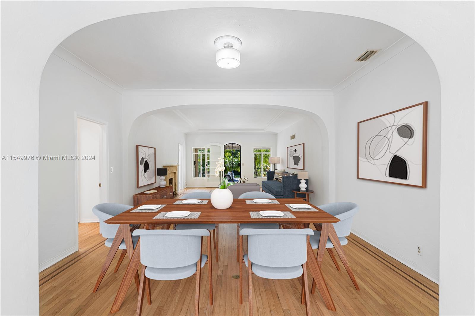 2935 North Bay Road Miami Beach, FL 33140 - Photo 3 of 36 a view of a dining room with furniture and wooden floor