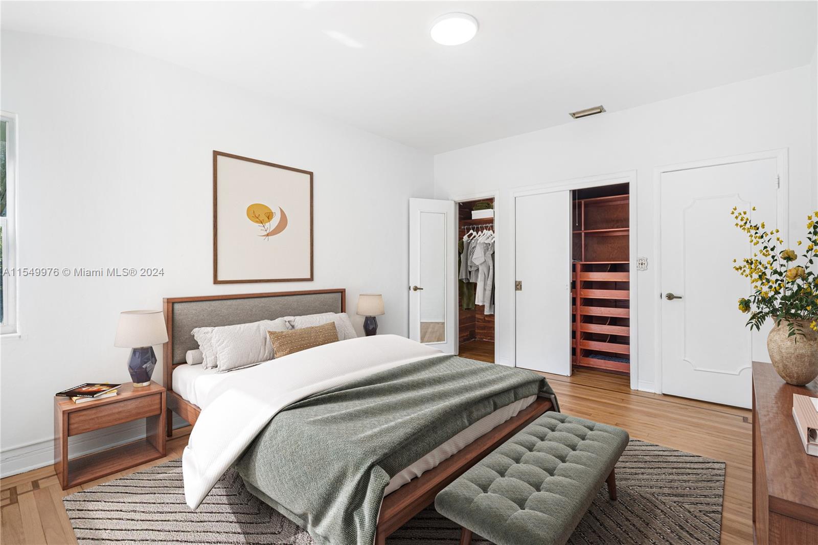 2935 North Bay Road Miami Beach, FL 33140 - Photo 6 of 36 a bedroom with a bed and a painting on the wall