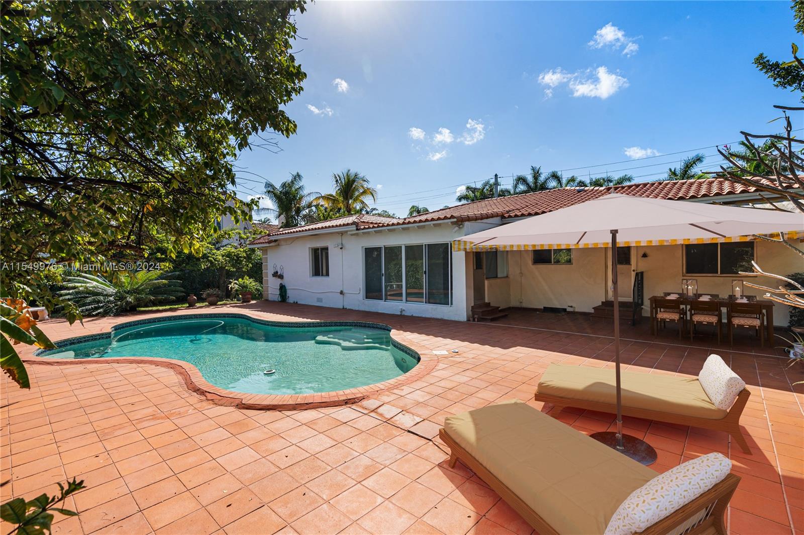 2935 North Bay Road Miami Beach, FL 33140 - Photo 9 of 36 a front view of a house with garden