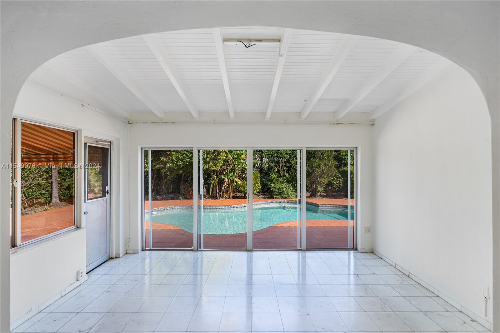 2935 North Bay Road Miami Beach, FL 33140 - Photo 10 of 36 a view of an entryway with a floor to ceiling window