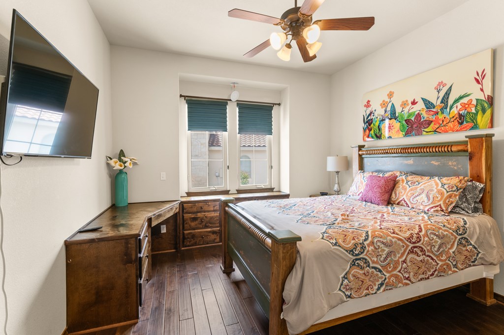 3801-1 Club House Road Kerrville, TX 78028 - Photo 13 of 26 a bedroom with a bed and a flat screen tv
