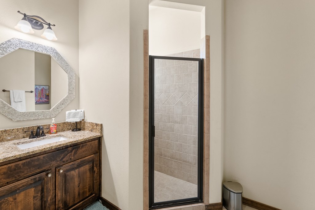 3801-1 Club House Road Kerrville, TX 78028 - Photo 14 of 26 a bathroom with a sink and a mirror